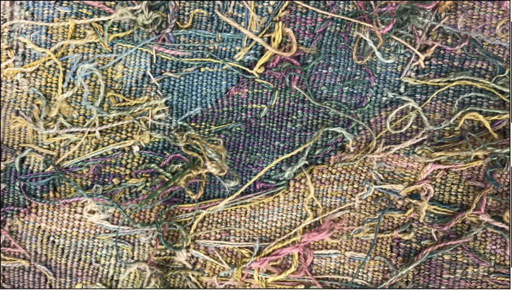 Exposed threads on the back of a tapestry